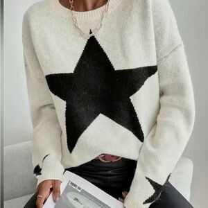 Oversized black star sweater. Size M & L